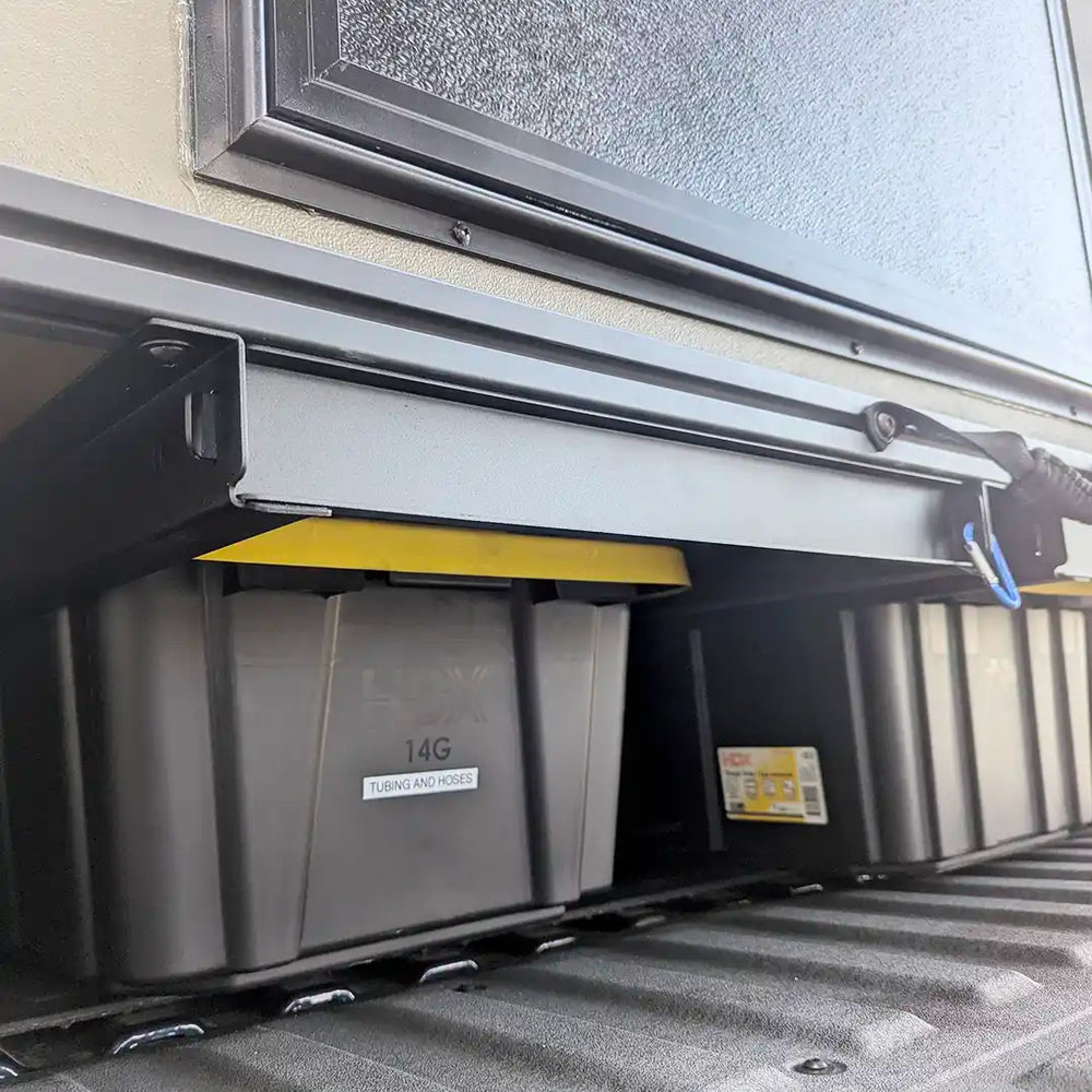 Close up of truckbed PLAT Platform system storage bin space with locking mechanism