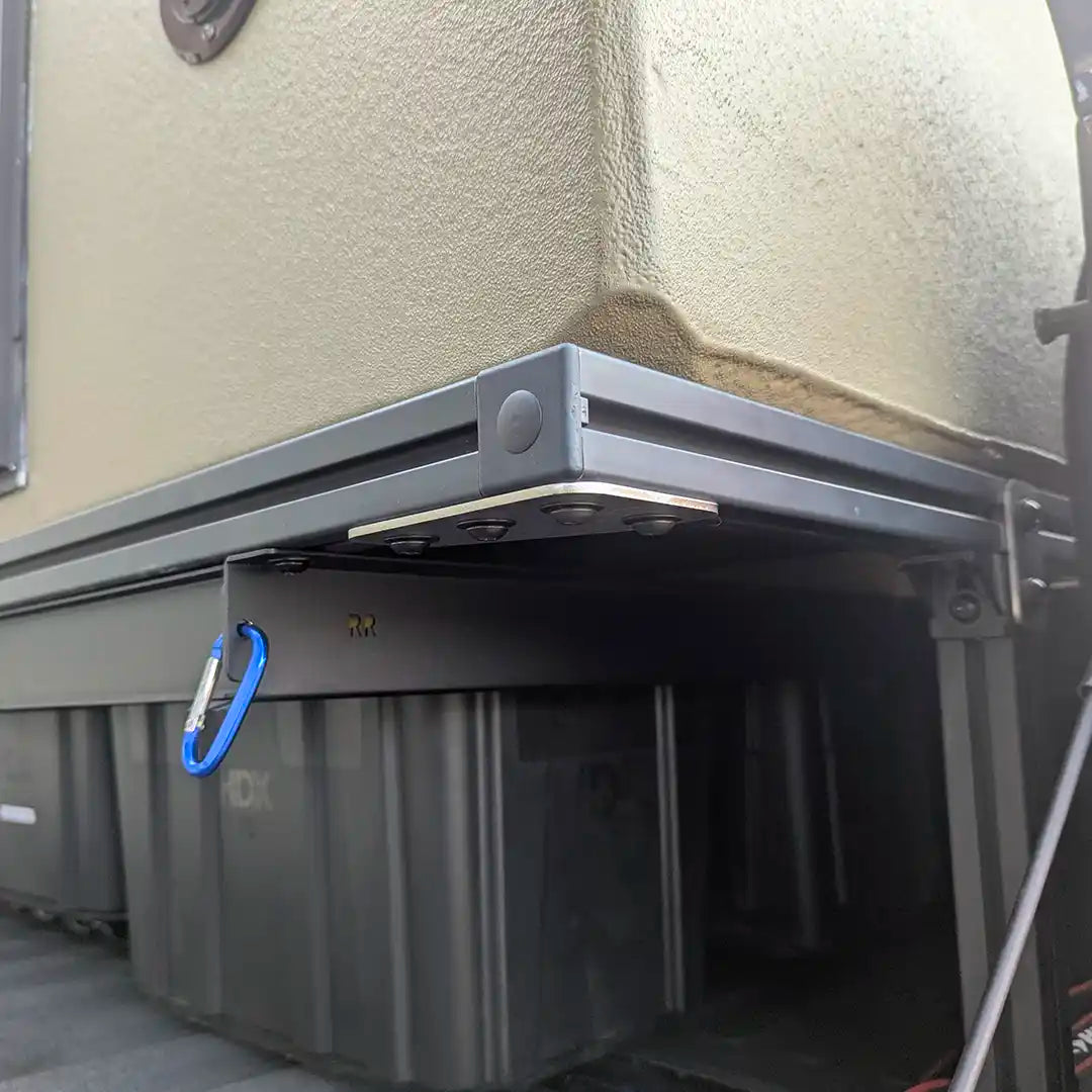 Closeup of truck bed corner 8020 aluminum extrusion frame of P.L.A.T. adaptable lifted truckbed system